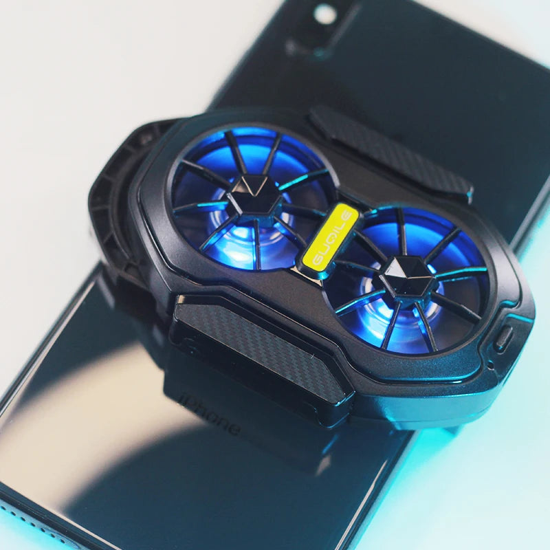 Rechargeable mobile phone cooler with dual fans on smartphone, designed for gaming and preventing overheating.