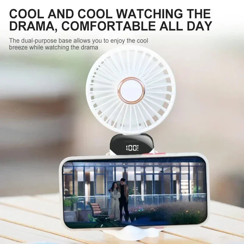 Portable mini neck fan used as phone stand with device propped up
